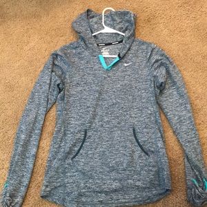 Nike pullover with pockets and a hood.